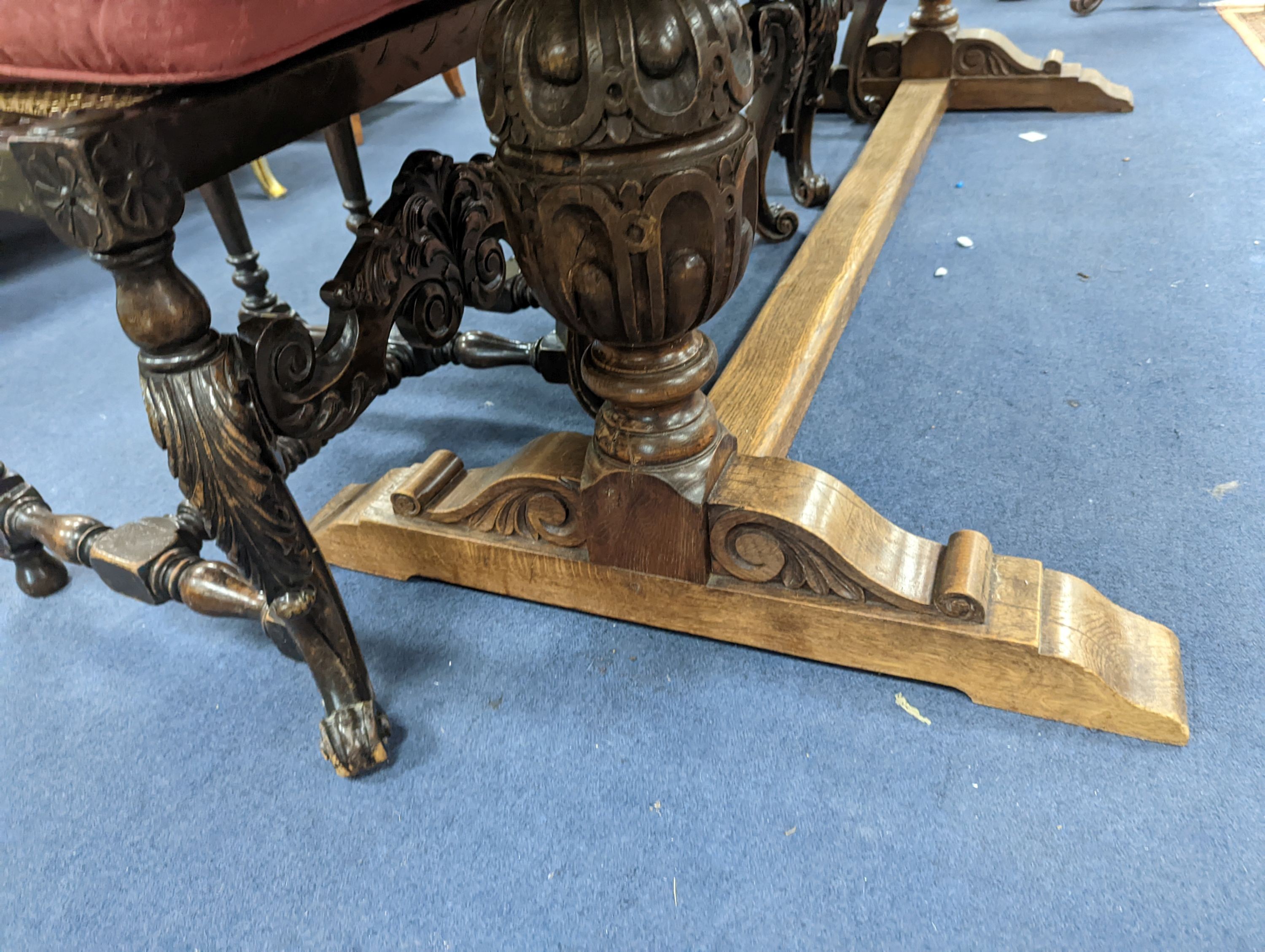 An 18th century style rectangular oak refectory dining table with central stretcher, length 230cm, depth 80cm, height 74cm